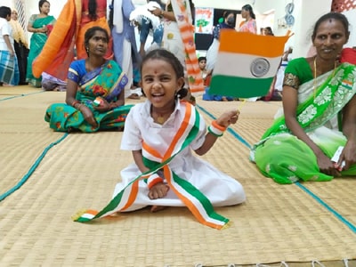 Children receive their flag